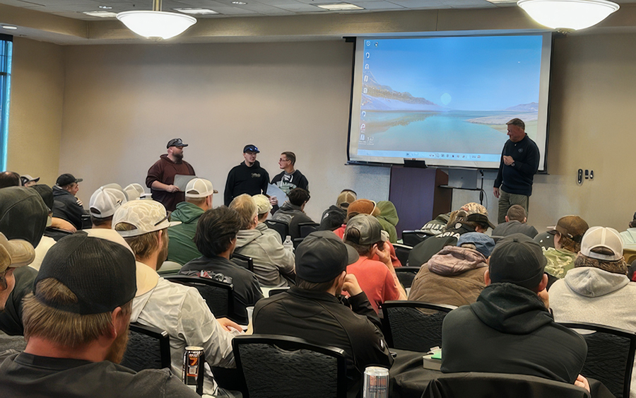 A group of people are watching a presentation on a projector.